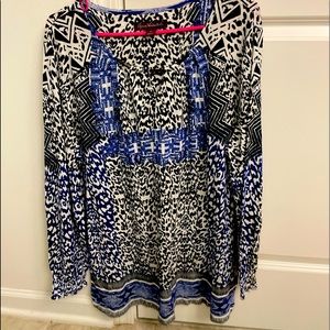 Tunic style blouse with multi colored animal print.  Never worn.
